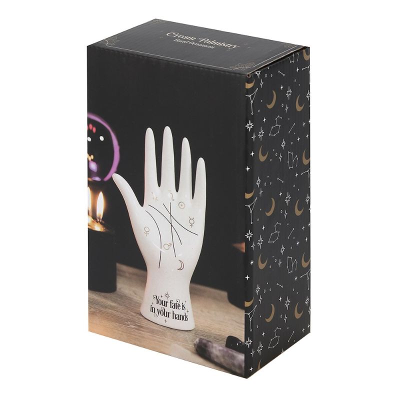 White ceramic palmistry hand ornament with gold astrology symbols, perfect for holding jewelry or as decor.