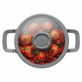 Versatile 20cm covered casserole with non-stick coating, glass lid, and silicone sleeves for safe handling.