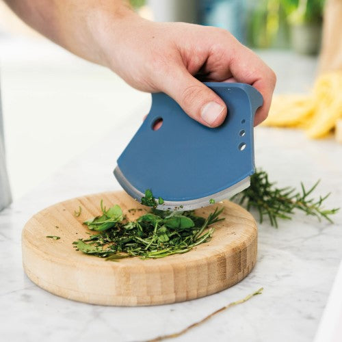 Half-moon shaped Berghoff Herb Cutter Set for easy chopping and mincing of fresh herbs with a concave cutting bowl.