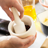 Berghoff Small Mortar and Pestle (11cm) for hand-grinding spices and herbs, featuring a stylish cork cover for aroma preservation.