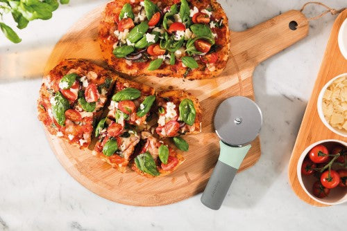 Ergonomic Berghoff Balance pizza cutter with a sharp stainless steel blade and recycled plastic handle for easy slicing.