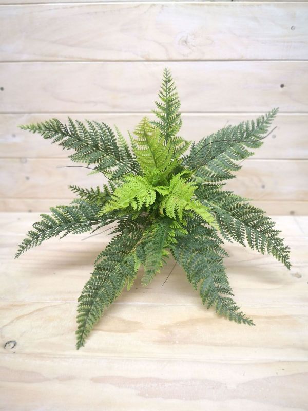 Lifelike small artificial fern bush in vibrant green, perfect for home or office decor without maintenance hassle.