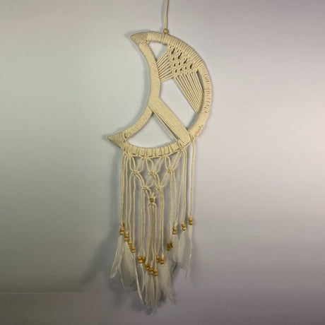 Intricate 27cm crescent moon macrame dreamcatcher, perfect for adding boho chic decor and a calming ambiance to any space.