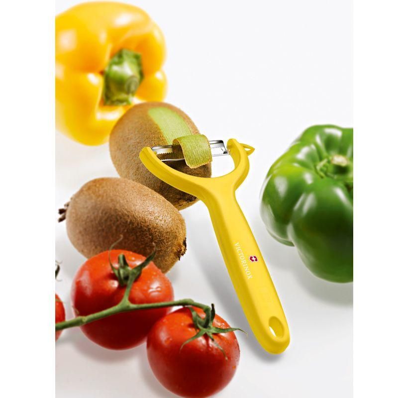 Yellow Victorinox Tomato & Kiwi Peeler with micro serrated double edge and ergonomic handle for effortless, precise peeling.