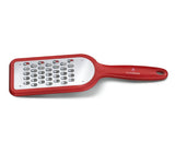 Red Victorinox coarse grater with ergonomic design, slip-resistant feet, and sharp blade for effortless grating of various ingredients.