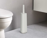 Joseph Joseph Flex 360 Toilet Brush in Ecru, featuring a flexible triple-action head and stylish storage holder for hygienic cleaning.