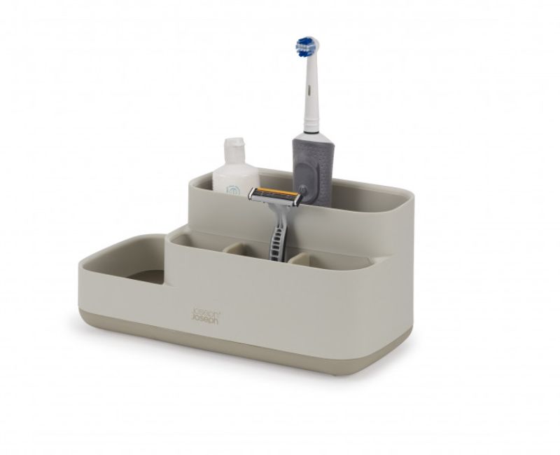 Stylish ecru bathroom caddy with divided compartments for organized storage of grooming essentials and a non-slip base.