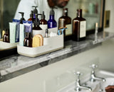 Joseph Joseph EasyStore Bathroom Caddy in Ecru, featuring divided compartments and a non-slip base for organized storage.