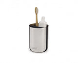 Elegant stainless steel toothbrush caddy with divider, ideal for organizing oral care items by the sink.