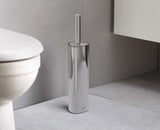 Sleek stainless steel toilet brush with flexible triple-action head for hygienic cleaning and stylish storage holder.