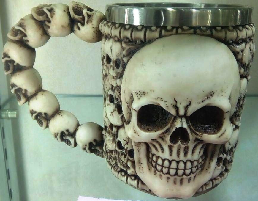 White skull tankard with intricate detailing, perfect for adding character to any drink, 16 x 11 x 11 cm.