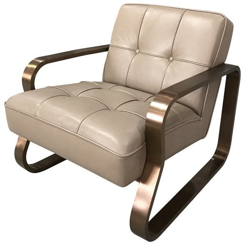 Luxurious Savona Boulder Brown armchair with brass accents, ideal for enhancing modern and classic interiors.