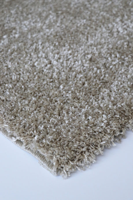 Plush Stirling Almond floor rug, 230cm, featuring durable 100% polypropylene, 30mm pile, and neatly bound edges for a modern home.