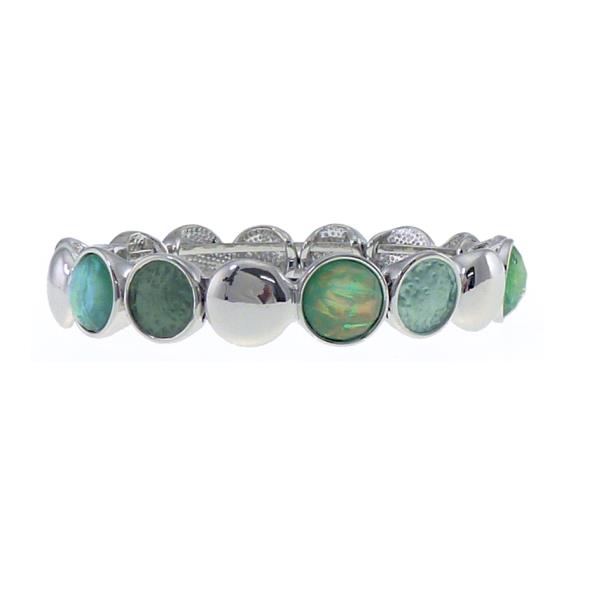 Silver bracelet featuring dark and light green circles, symbolizing harmony and balance, with a modern magnet fastening.
