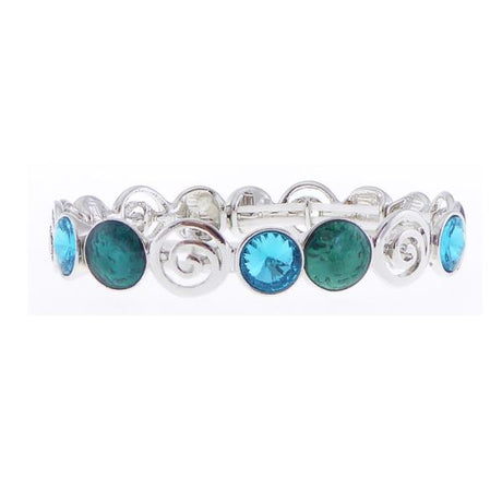 Elegant silver bracelet with pinwheel design, aqua crystals, and dark green circles, perfect for any occasion.