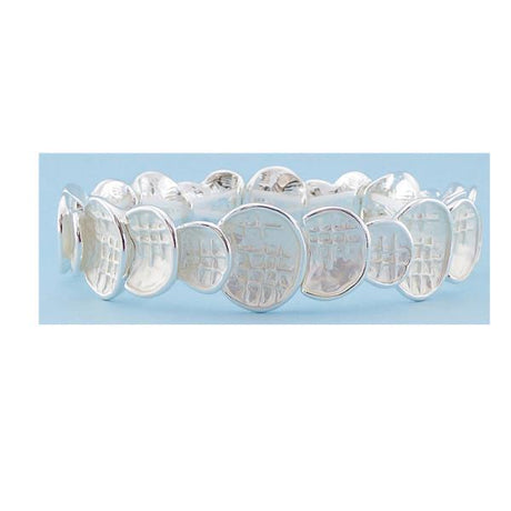 Elegant bracelet featuring shiny and matte silver textured circles for a versatile and stylish accessory.