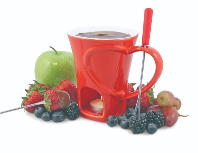 Ceramic chocolate fondue mug set with two forks and a tea light candle for romantic dipping of fruits and treats.