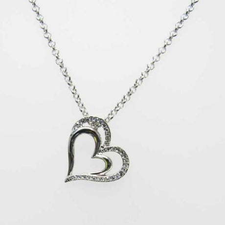 Elegant heart pendant nested in a crystal heart, perfect for expressing love and adding charm to any outfit.