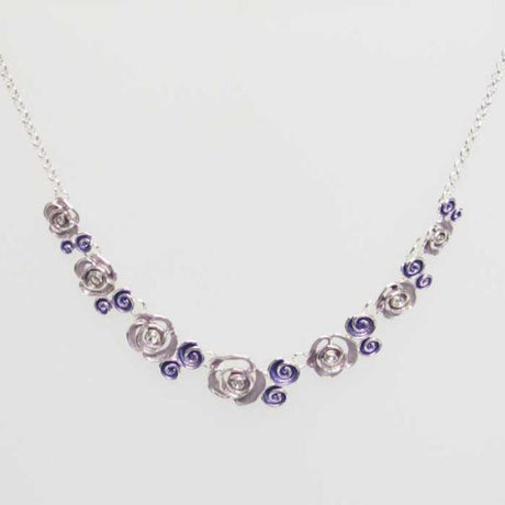 Delicate pink rose necklace with shimmering crystals, 30 cm chain, perfect for casual and formal occasions.