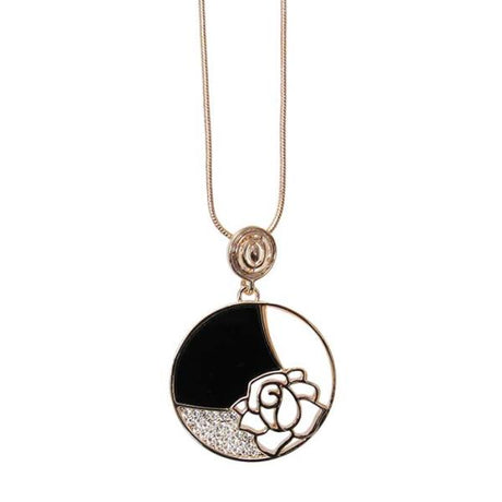 Art Deco-inspired Jax Necklace featuring a rose gold pendant with a rose design, black and white shell accents, and crystals.