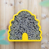 Beehive-shaped bee house for solitary bees, made from FSC-certified materials, enhancing gardens and supporting biodiversity.