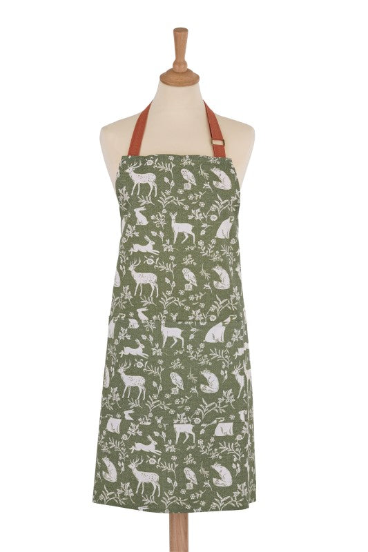 Cotton apron featuring a whimsical woodland scene with playful animals on a sage green fabric, sustainable and adjustable for comfort.