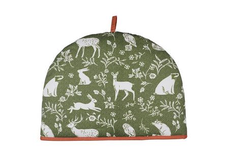 Whimsical sage green tea cosy featuring woodland animals like deer and foxes in a charming block print design.