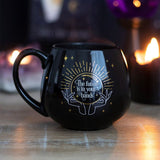 Black Fortune Teller mug changes color to reveal hidden fortune, featuring a crystal ball and whimsical text. Ideal for tea lovers.