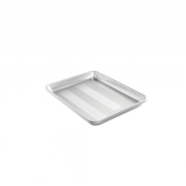 Nordic Ware Prism Quarter Sheet Pan with embossed design for even baking, durable construction, and a stylish look for home bakers.