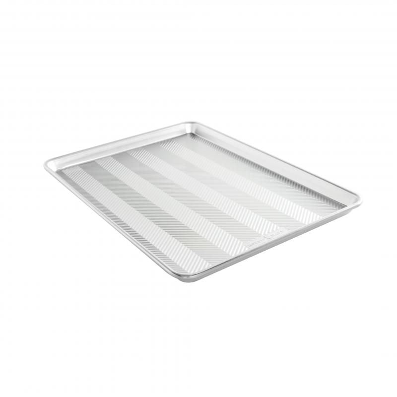 Nordic Ware Prism Big Sheet: oversized aluminum baking sheet with embossed design for even heating and durability.