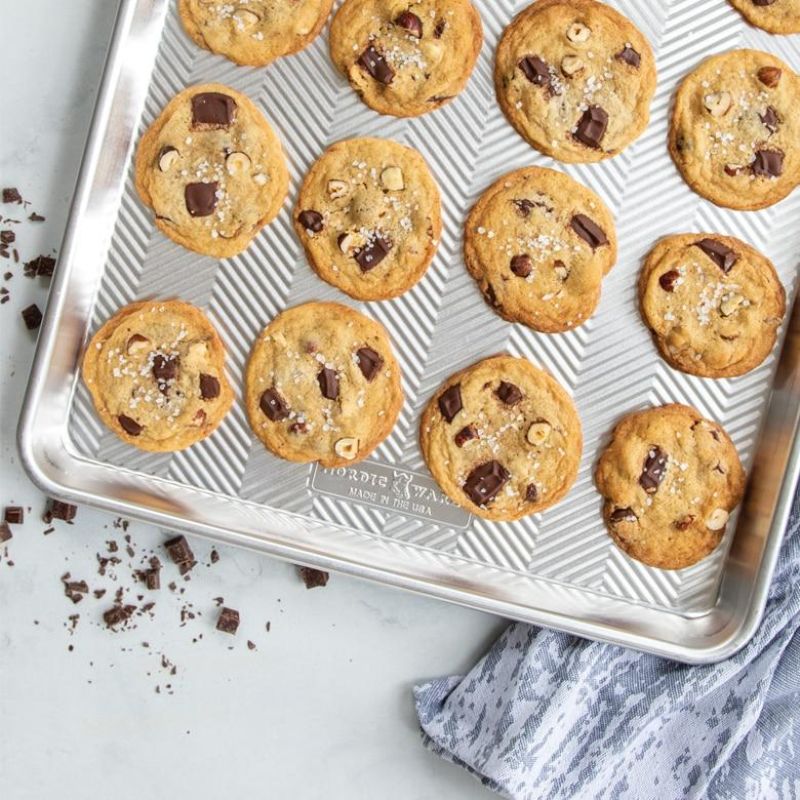 Nordic Ware Prism Big Sheet: Large aluminum baking sheet with grid design for even baking and easy cleanup, ideal for cookies and roasting.