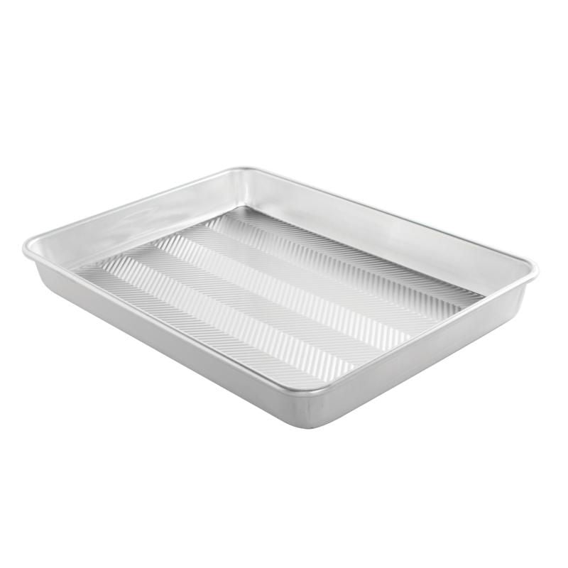 Nordic Ware Prism High Sided Baking Pan with durable aluminum, grid texture for even baking, and strong encapsulated rims.