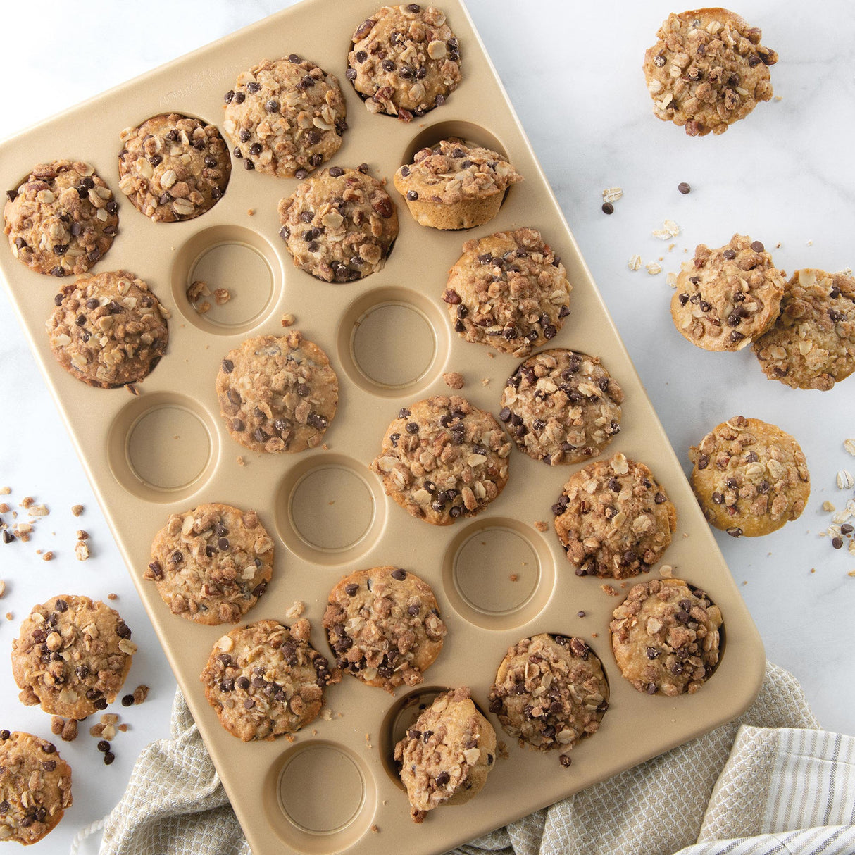 Nordic Ware 24 Cup Petite Muffin Pan, perfect for baking mini muffins, quiches, and tarts with a durable non-stick surface.