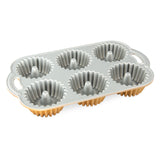 Nordic Ware Brilliance Bundtlette Pan for six mini Bundt cakes, featuring durable cast aluminum and nonstick finish for easy baking.