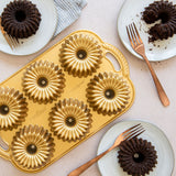 Nordic Ware Brilliance Bundtlette Pan for baking six mini Bundt cakes, crafted from durable cast aluminum with nonstick coating.