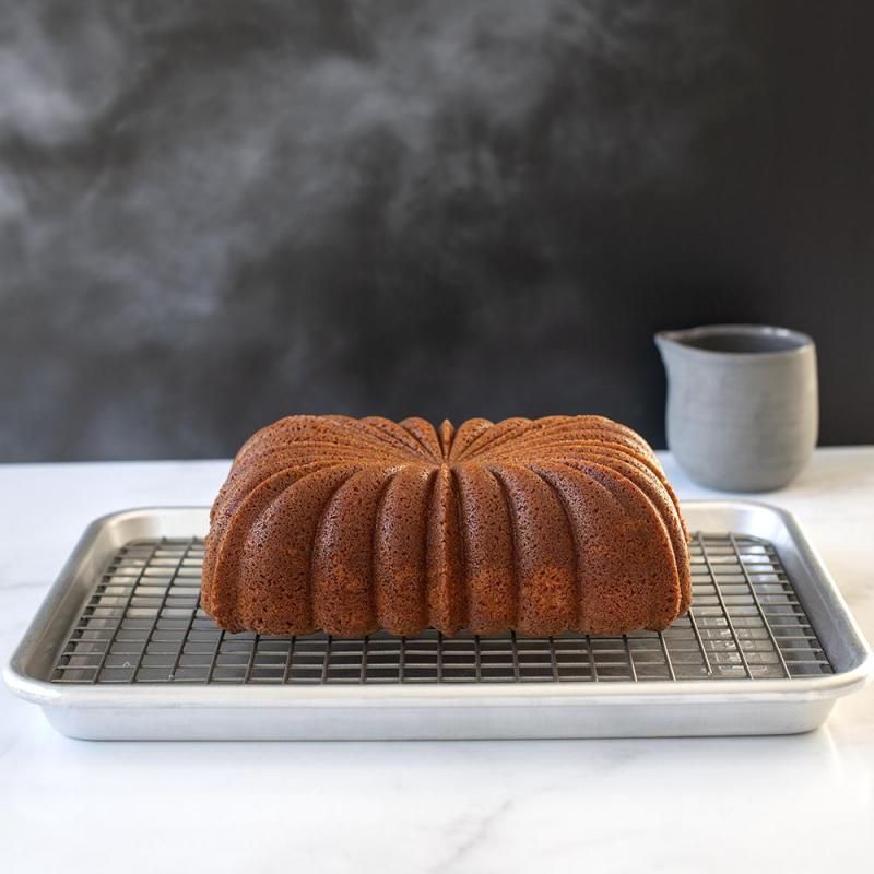 Nordic Ware Classic Fluted Loaf Pan, 25.5x15x8cm, ideal for baking elegant fluted loaves and desserts with nonstick finish.