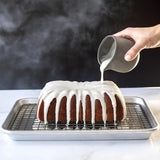 Nordic Ware Classic Fluted Loaf Pan in black cast aluminum, perfect for baking elegant fluted loaves and desserts.