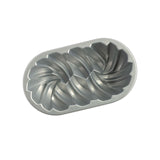 Nordic Ware 75th Braided Loaf Pan in aluminum, featuring a decorative braided design for beautifully baked breads and cakes.