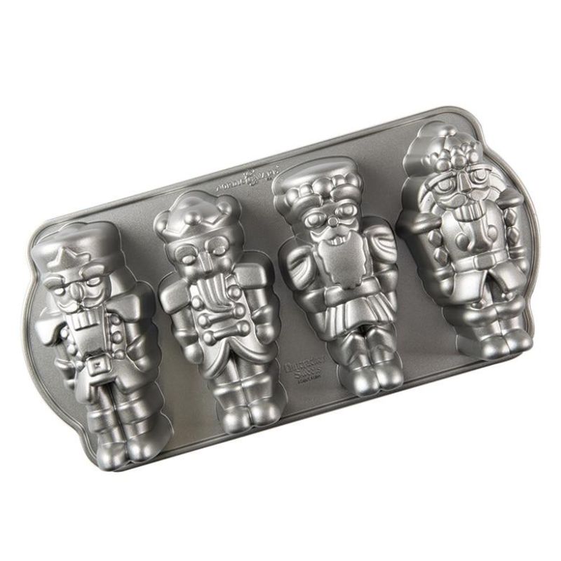 Nordic Ware Nutcracker Cakelet Pan in sparkling silver, featuring festive nutcracker shapes for holiday baking delights.