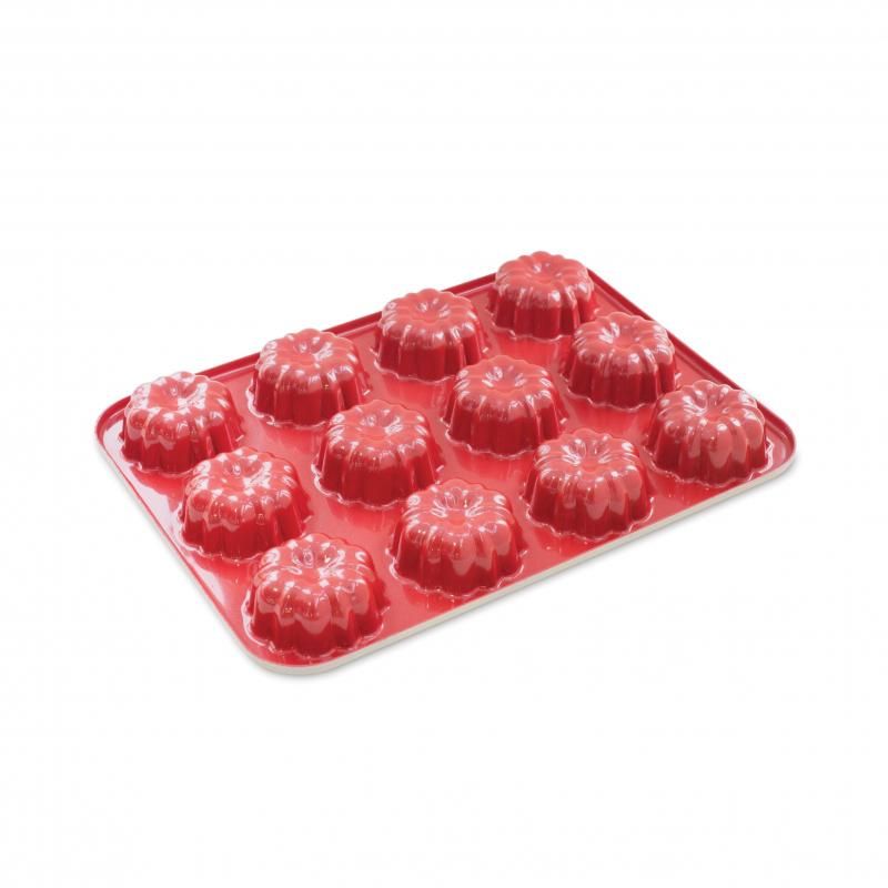 Nordic Ware Mini Bundt Cupcake Pan in red, designed for baking twelve personal-sized Bundt cakes with even heat distribution.