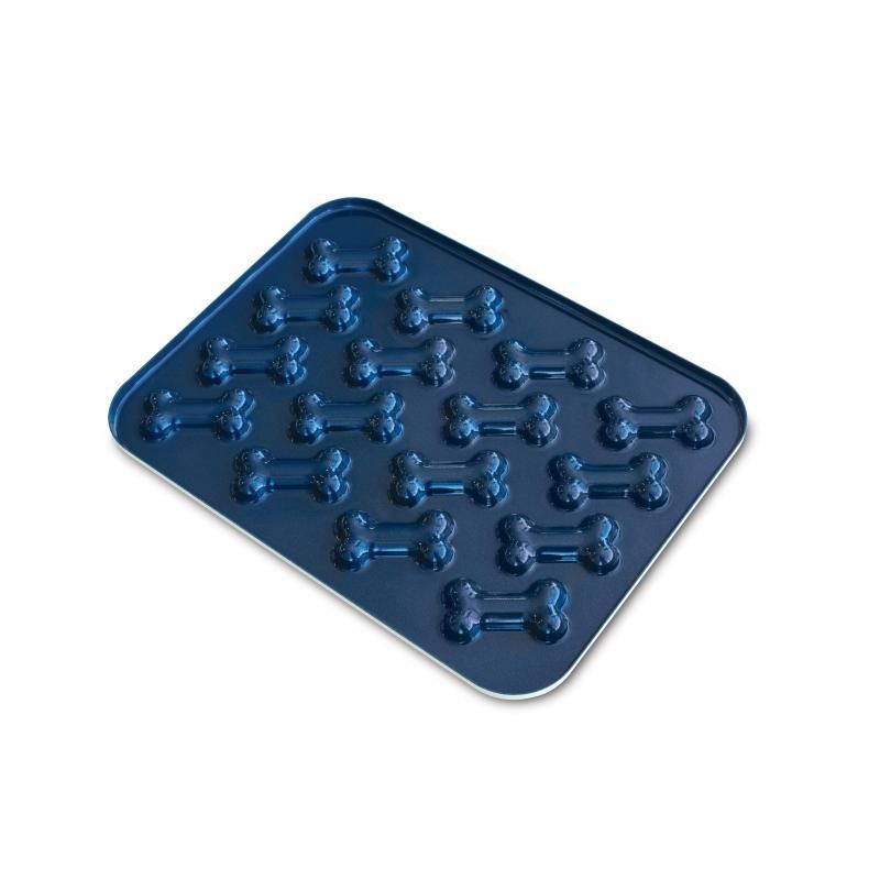 Nordic Ware Puppy Love Treat Pan with 16 bone-shaped cavities for baking healthy dog treats at home.