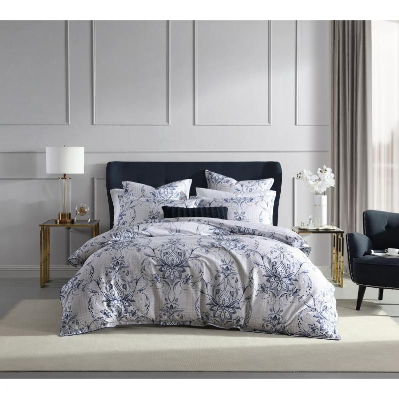 Luxurious Queen quilt and pillowcases in crisp white, navy, and linen with elegant damask and hounds-tooth patterns.