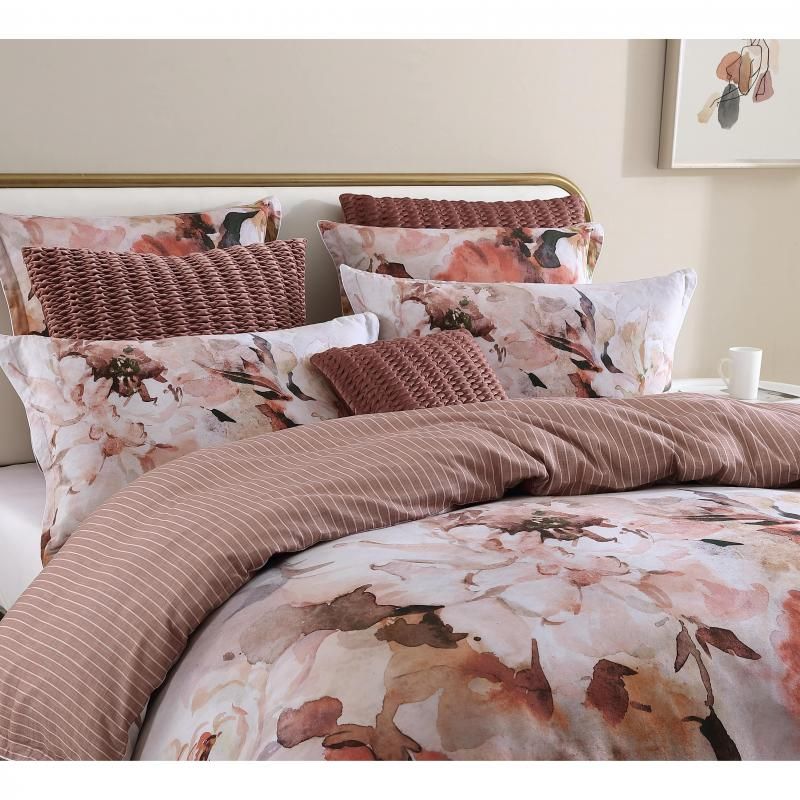 King size quilt and duvet set featuring oversized peach and pink blooms, crafted from 100% cotton for luxurious comfort.