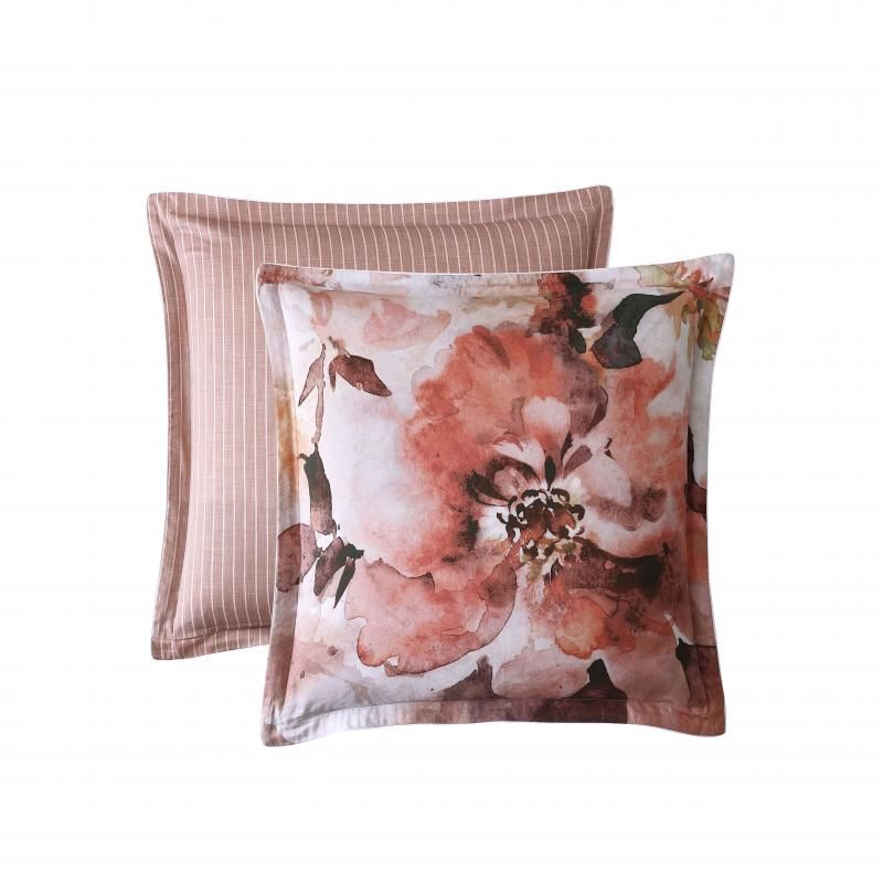 Elegant peach pillowcase featuring oversized floral prints, striped linen backing, and white cord piping for a sophisticated touch.