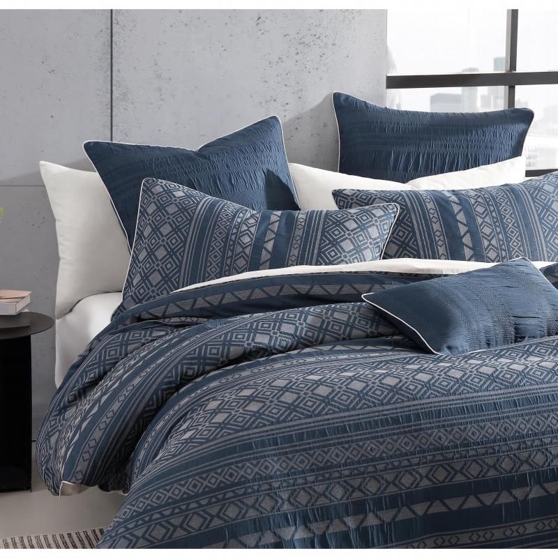 Platinum Orlando jacquard pillowcase in indigo, featuring geometric patterns and a luxurious blend for stylish bedroom decor.