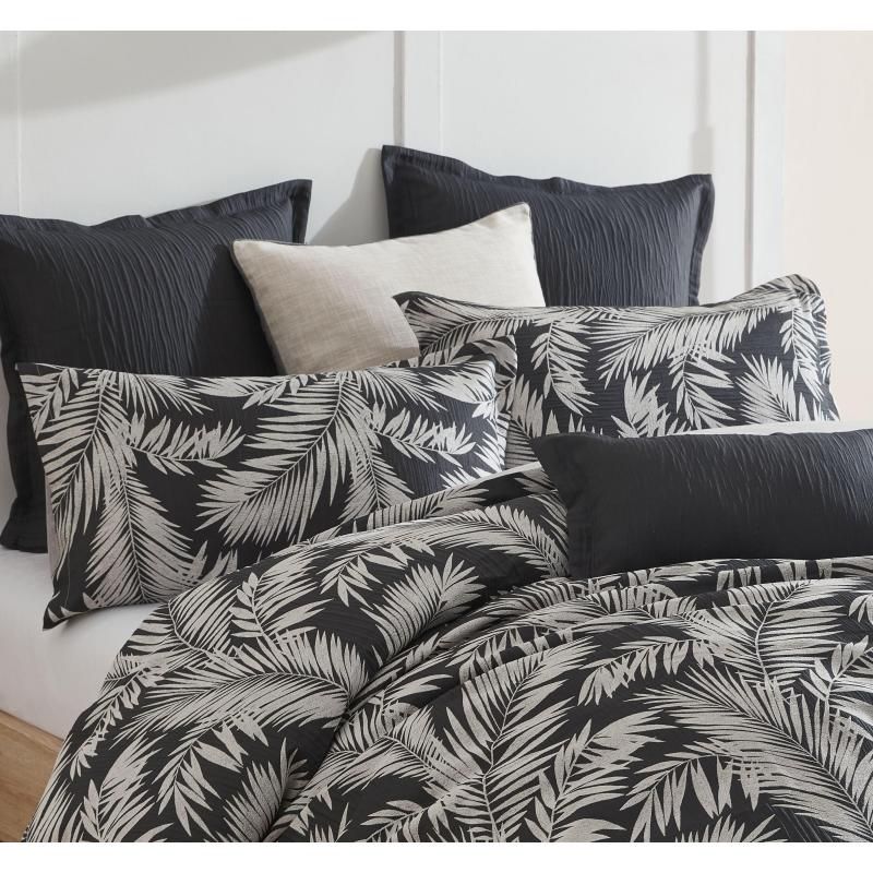 Luxurious black jacquard European pillowcase featuring intricate palm patterns for elegant bedroom decor.