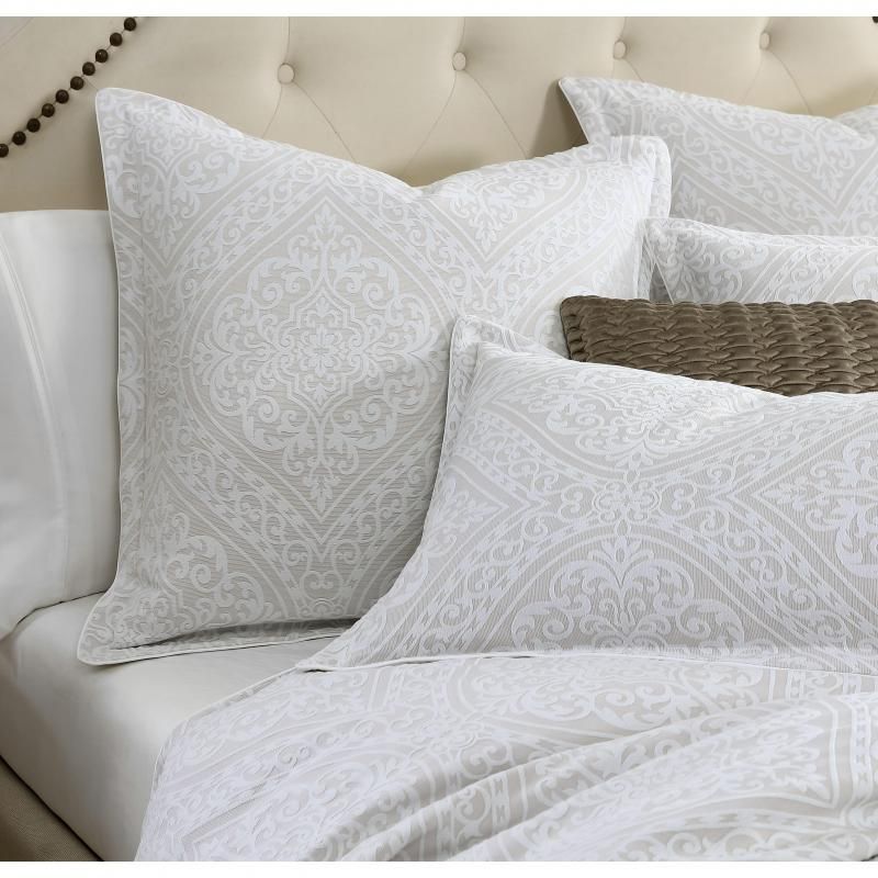 Elegant stone-colored Arlet Jacquard quilt set for queen bed, featuring Neo-Classical design and soft cotton-polyester blend.