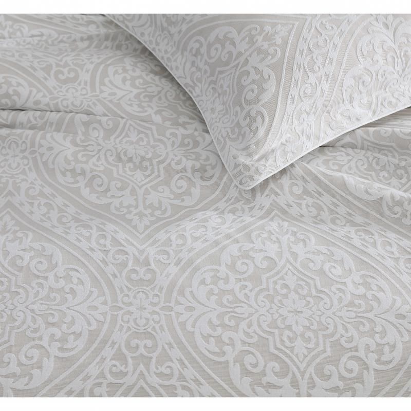 Luxurious King size quilt and duvet set in Stone hue, featuring elegant jacquard stitching and classic symmetrical motifs.