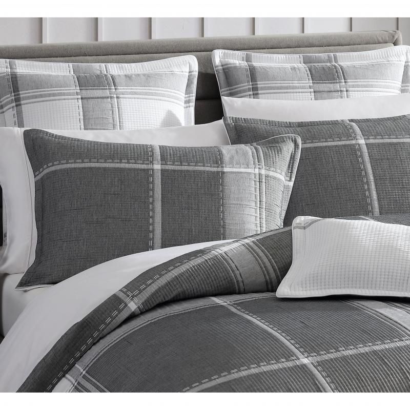 Charcoal jacquard quilt set for queen bed, featuring intricate checks and soft self-flanged edges for elegant bedroom decor.