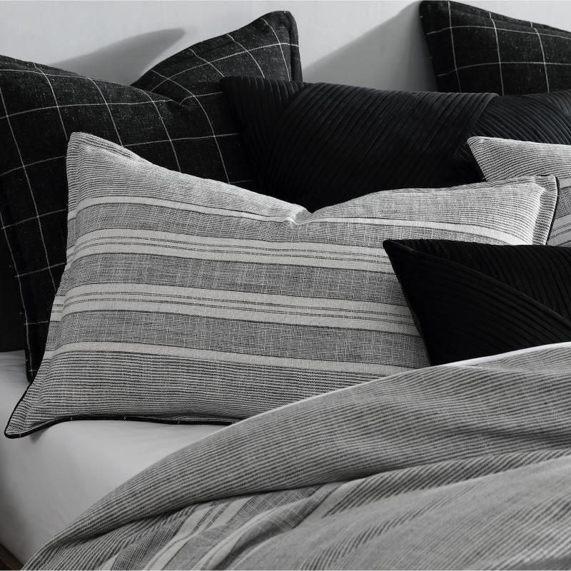 Sophisticated coal-colored European pillowcase featuring stripe and check jacquard patterns for modern bedroom decor.